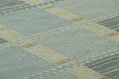 Rug & Kilim’s Scandinavian Rug In Blue And Cream, With Geometric Patterns