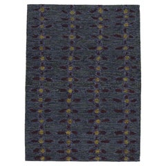 Rug & Kilim’s Scandinavian Rug in Indigo, with Red and Yellow Floral Patterns