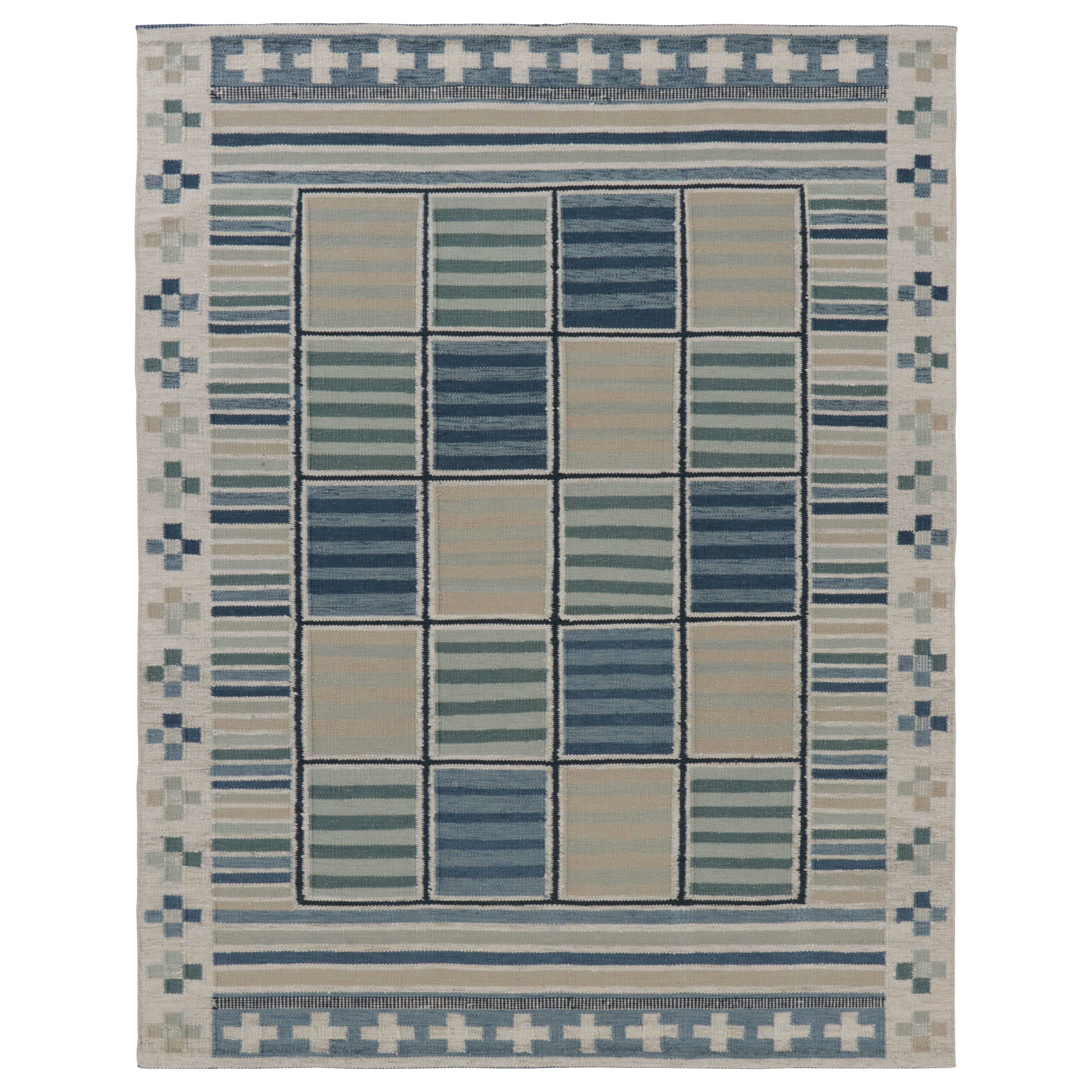 Rug
Kilim
s skandinavischer Teppich in ruhigem Grau und blauem geometrischem Raster