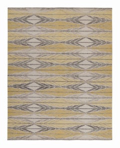 Rug & Kilim è un kilim personalizzato in stile scandinavo con motivo geometrico oro e grigio