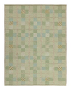 Rug & Kilim, un kilim personalizzato in stile scandinavo con motivi in verde, beige e blu