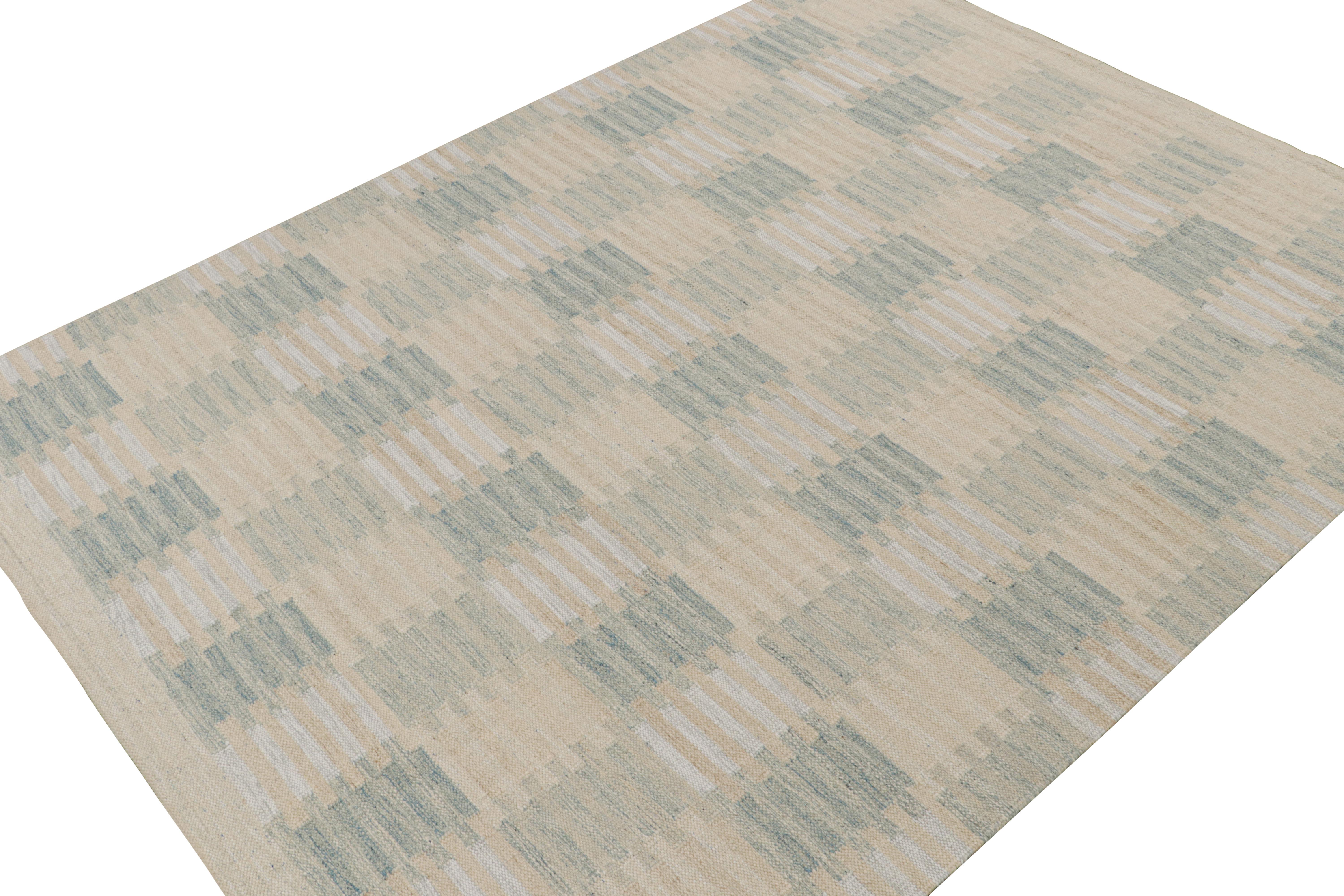 A smart 9x12 Swedish style kilim rug from our award-winning Scandinavian flat weave collection. Handwoven in wool, cotton & undyed natural yarn.

On the Design: 

This rug enjoys geometric patterns in blue & beige. Keen eyes will admire undyed,