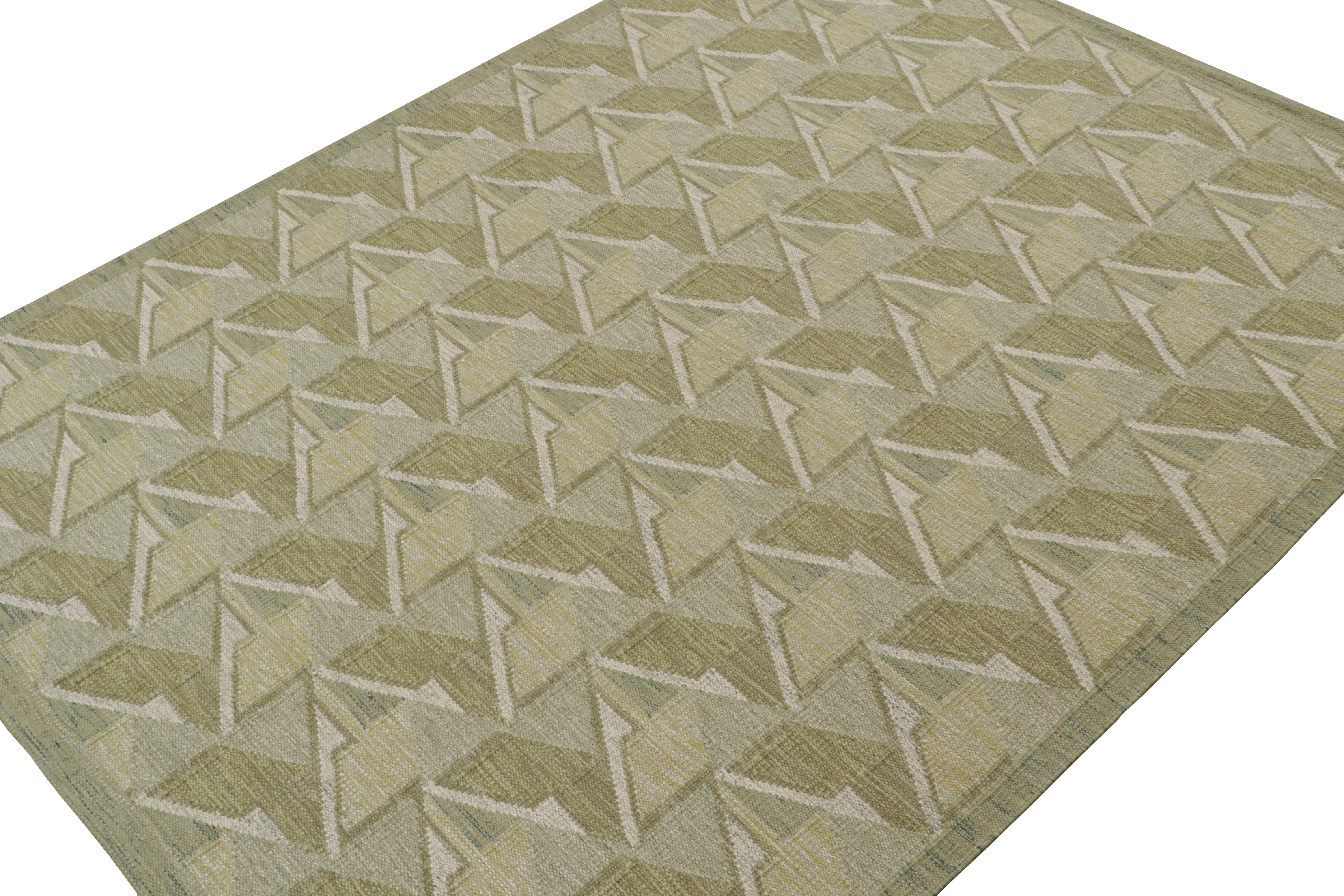 A smart 9x12 Swedish style custom kilim from our award-winning Scandinavian flat weave collection. Handwoven in wool, cotton & undyed natural yarns

On the Design: 

This rug enjoys geometric patterns in tones of green. Keen eyes will admire undyed,