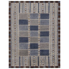 Rug & Kilim: tappeto personalizzato in stile scandinavo con motivi grigio-blu