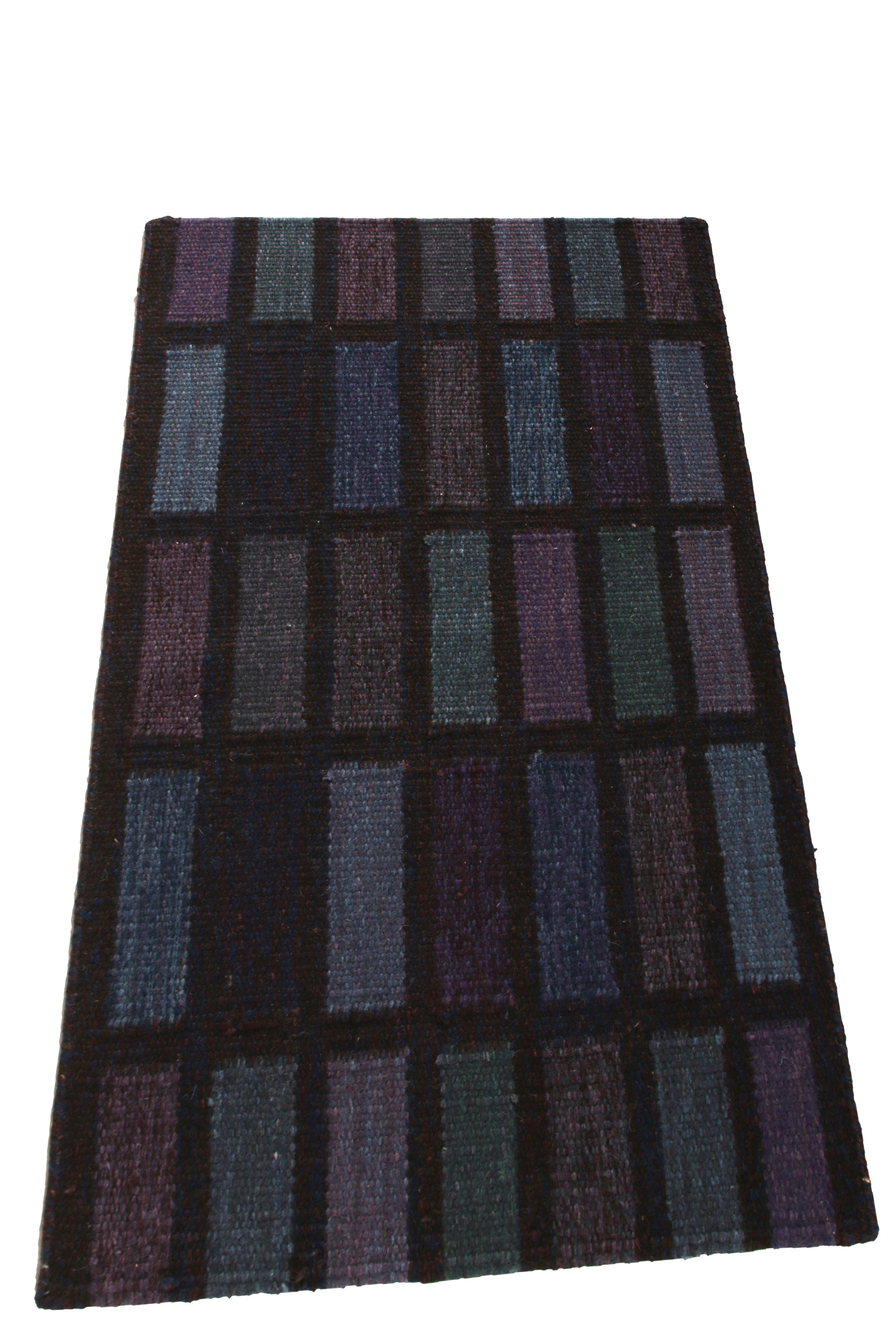 This 2x3 Kilim hails from the gift-size selections of Rug & Kilim’s Scandinavian Collection, remarking a bold take on Swedish Deco styles. This flat weave enjoys deep purple, blue and teal patterns in playful alternating squares atop a black