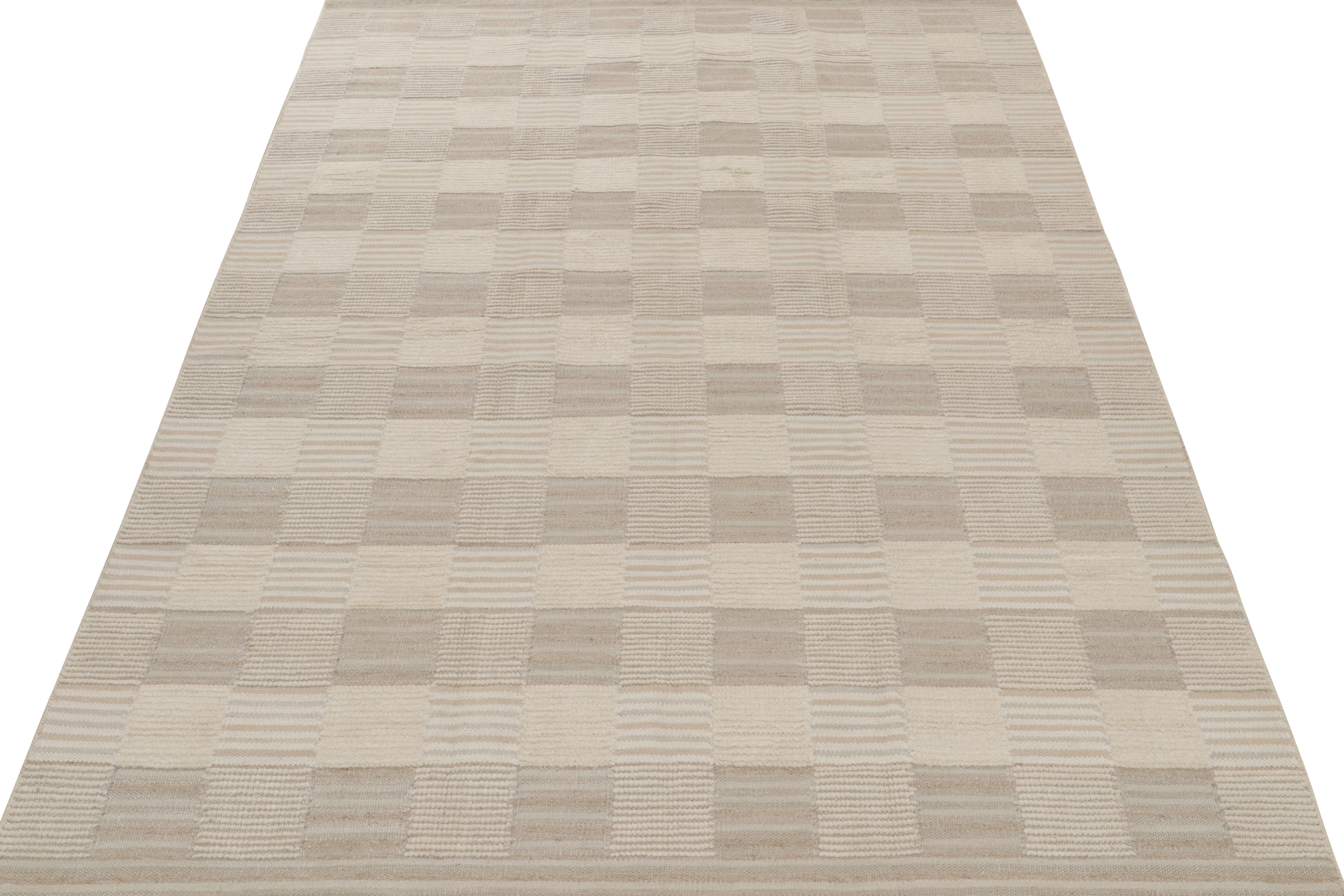 Handwoven in wool, a smart Swedish style kilim rug design from our award-winning Scandinavian flat weave collection. 

This 9x12 rug enjoys a subtle high-low texture married to geometric patterns in crisp beige-brown, white and gray. Keen eyes will