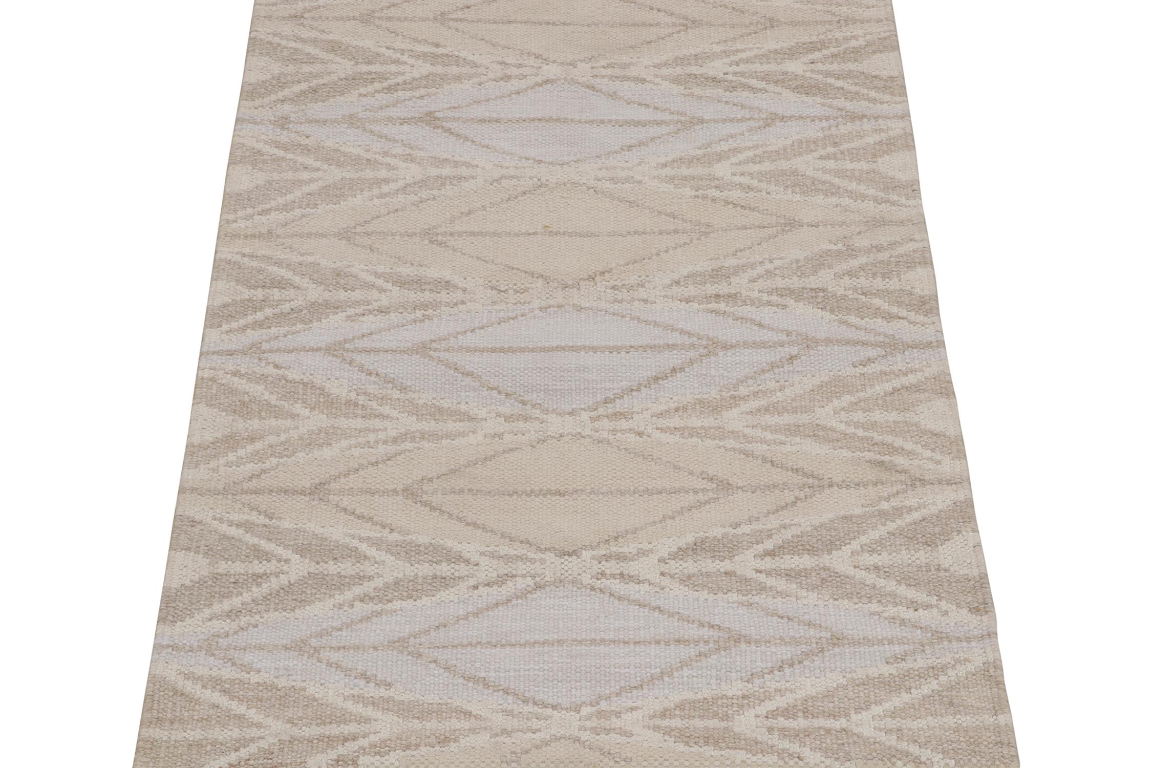 A smart 3x5 Swedish style kilim from our award-winning Scandinavian flat weave collection. Handwoven in wool. 
On the design: 
This rug enjoys a mesmeric sense of movement with finely detailed geometric patterns in beige, white, gray, and blue. Keen