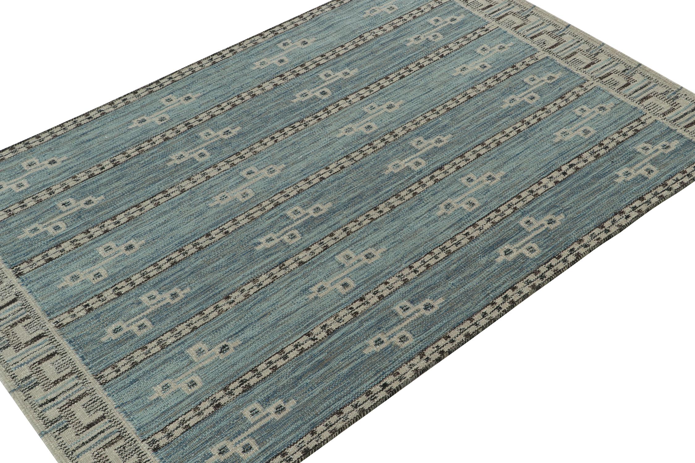 A smart 6x9 Swedish style kilim Rug & Kilim’s award-winning Scandinavian flat weave collection. Handwoven in wool. 
On the Design: 
This rug design is one of our most well-received in the collection, with geometric patterns and stripes in blue,