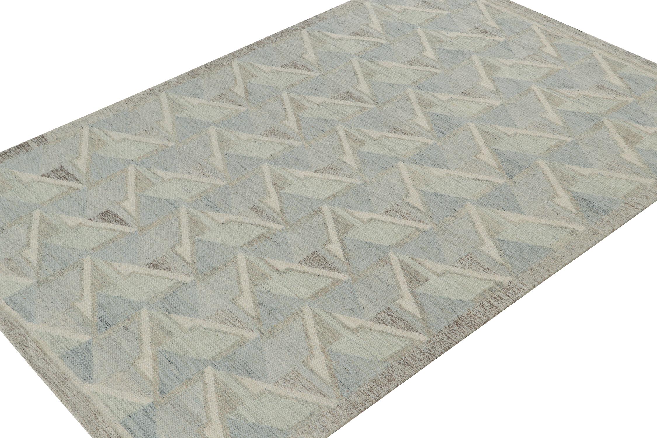 A smart 6x9 Swedish style kilim from our award-winning Scandinavian flat weave collection. Handwoven in wool. 
On the Design: 
This rug enjoys geometric patterns in the most complementary, cool blue, white and gray tones and soothing repetition.