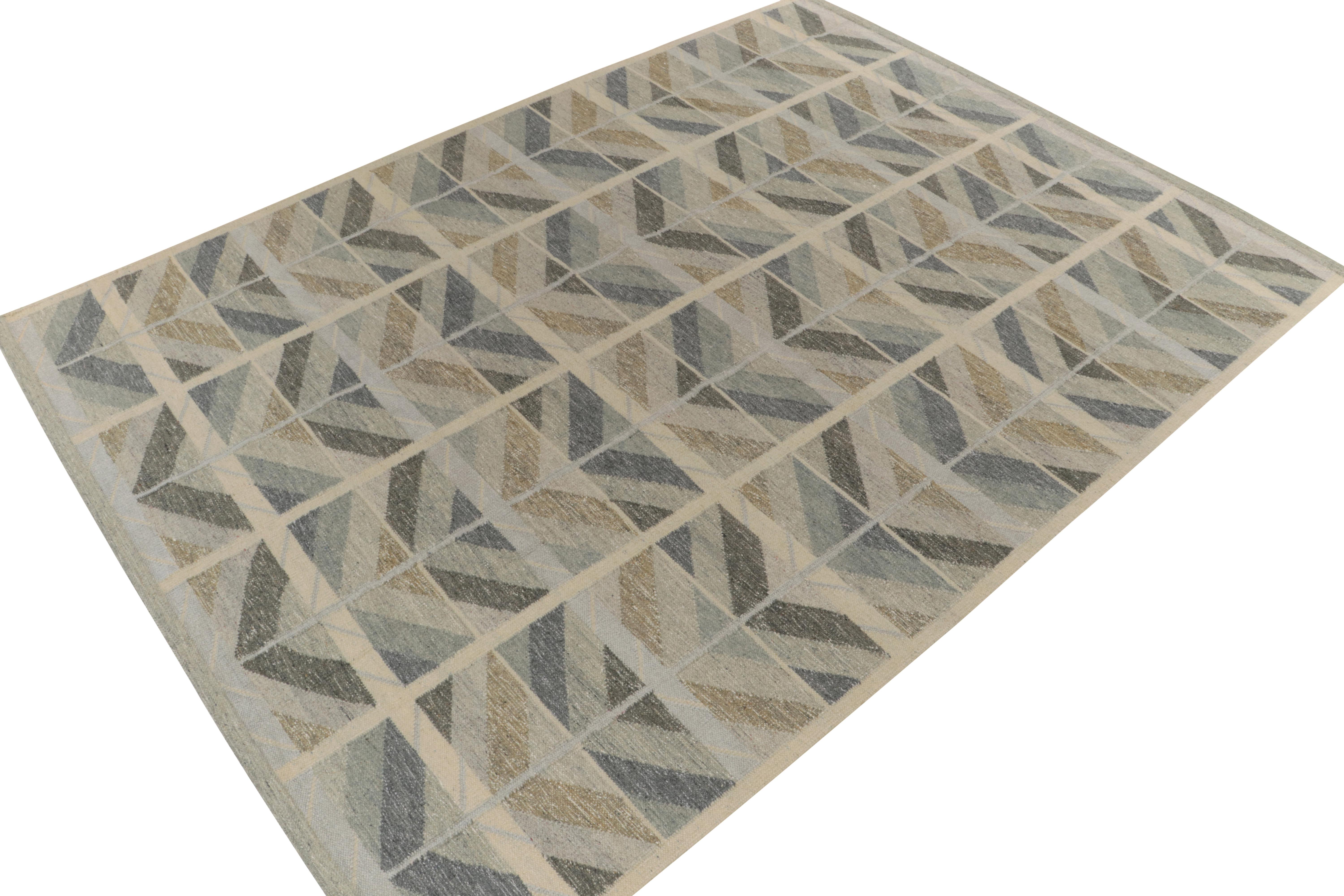 From our celebrated Scandinavian flat weaves, a 10x14 Swedish Deco style kilim exemplifying contemporary innovations of mid-century modern style. 

On the Design: Handwoven in wool, the crisp geometric chevrons enjoy smart alternating tones of