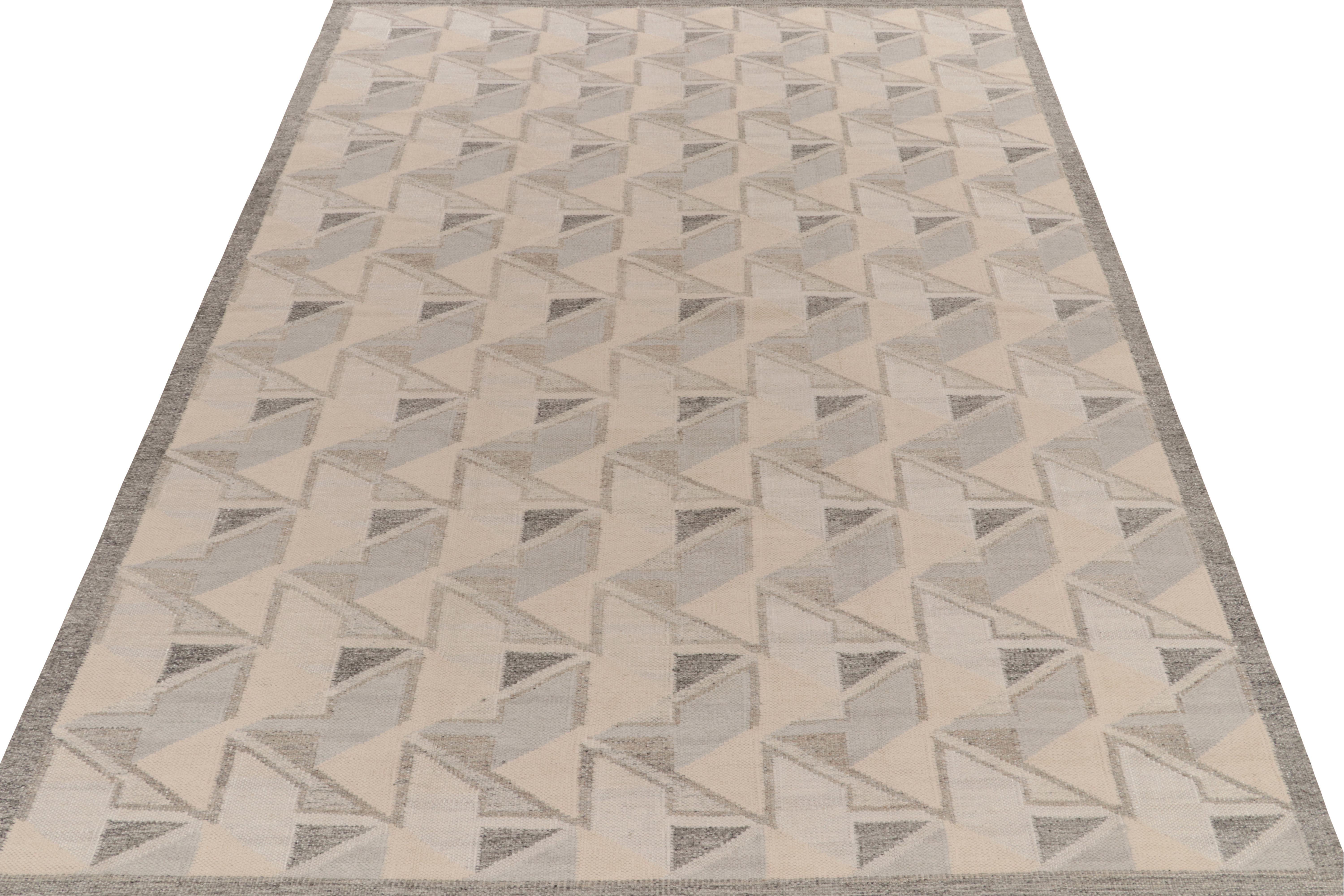 Rug & Kilim’s 8x12 Scandinavian style kilim rug, from our celebrated Swedish Deco-style flatweave collection. 

On the Design: This area rug enjoys a take on mid-century modern aesthetics with a smart geometric pattern casting an 3D impression in