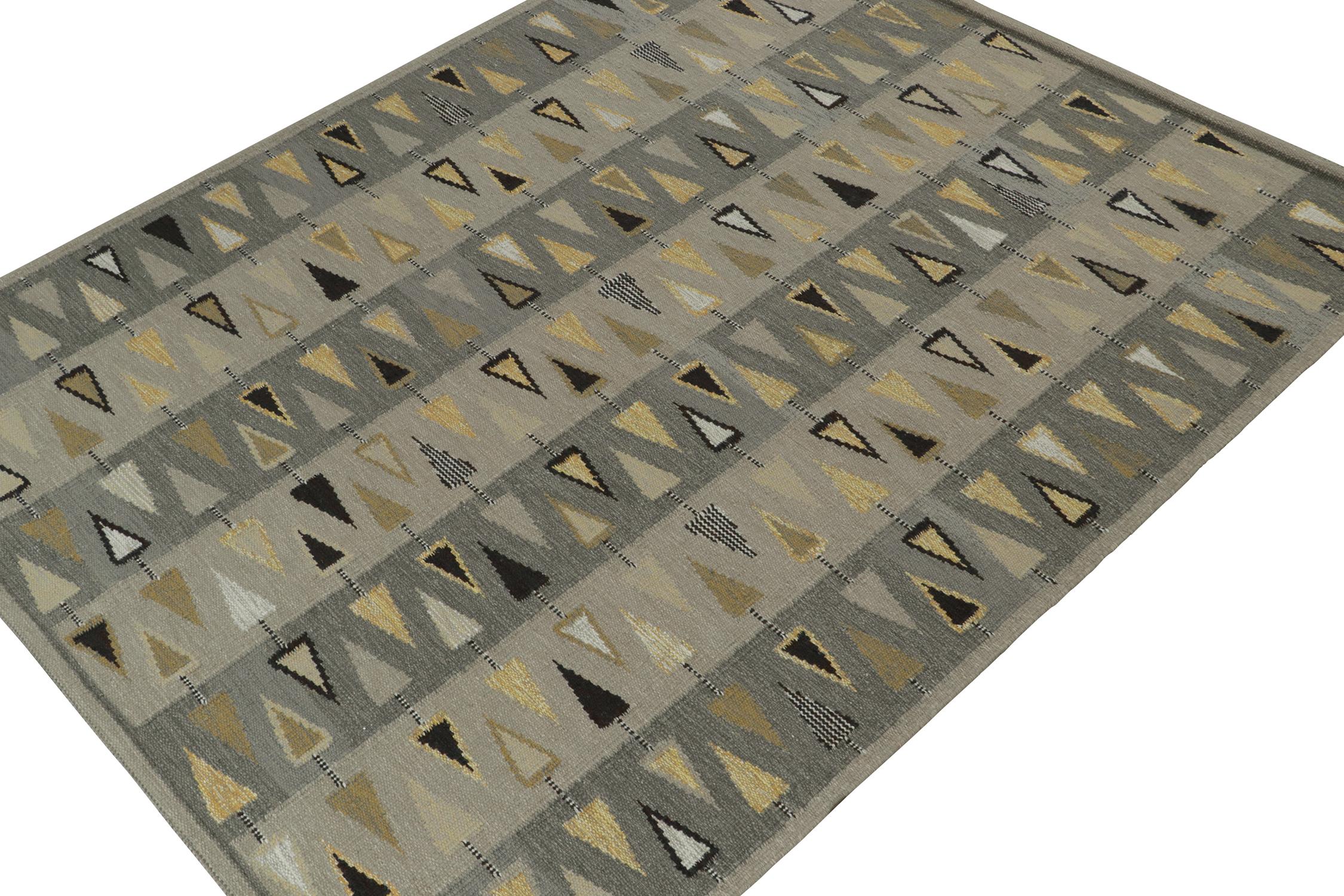 A smart 8x10 Swedish style kilim from our award-winning Scandinavian flat weave collection. Handwoven in wool. 
On the Design: 
This rug enjoys a playful sense of movement and color, with triangle geometric patterns in gold, black, and white