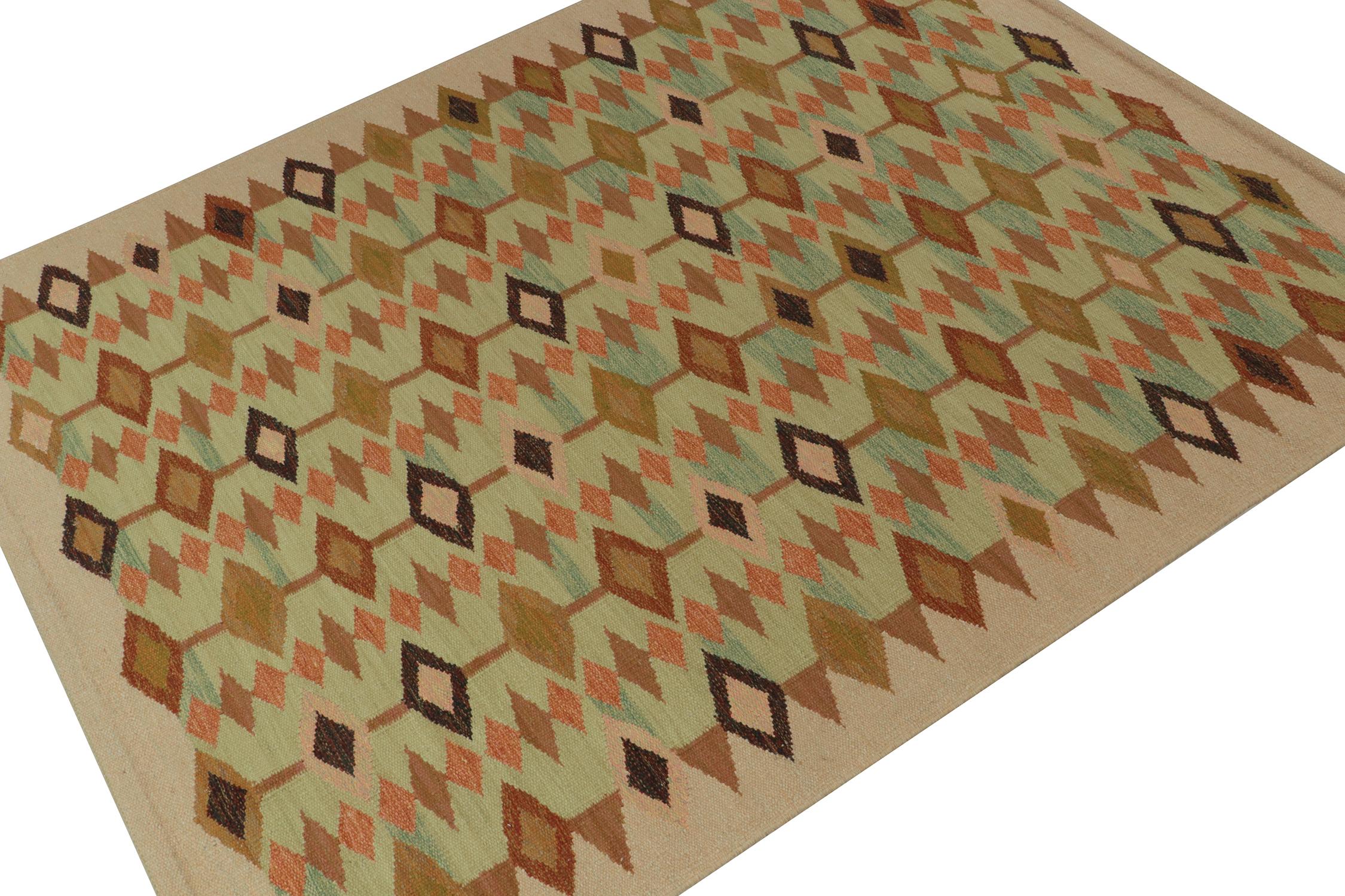 A smart 8x10 Swedish style kilim from our award-winning Scandinavian flat weave collection. Handwoven in wool. 
On the Design: 
This rug enjoys natural movement in diamond geometric patterns of beige-brown and green with warm red and orange