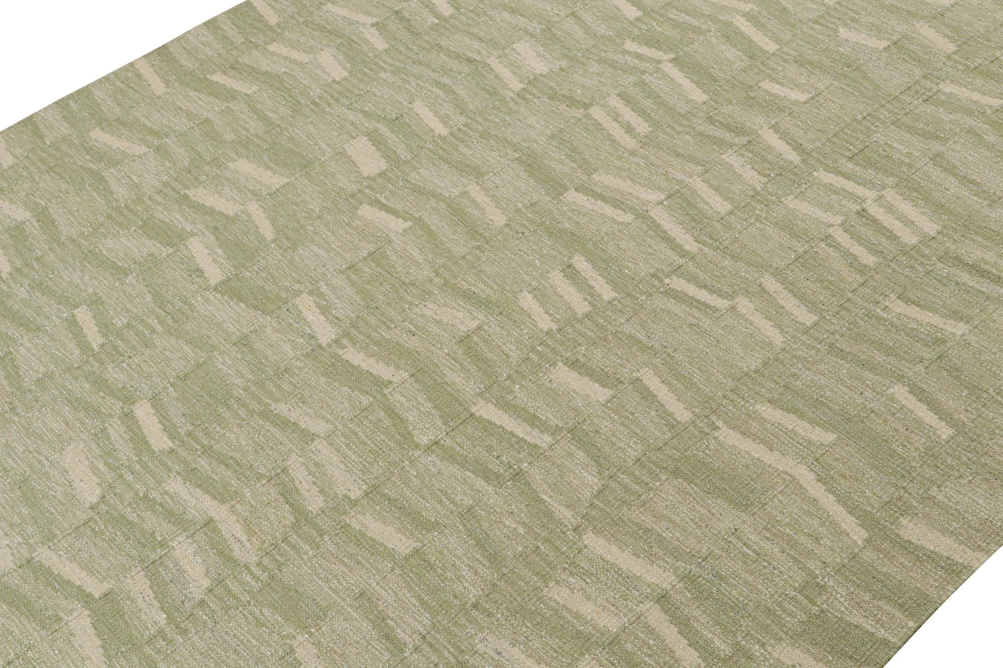 A smart 9x12 Swedish style kilim from our award-winning Scandinavian flat weave collection. Handwoven in wool. 

On the Design: 

This rug enjoys geometric patterns in enticing tones of green & beige. Keen eyes will admire undyed, natural yarns