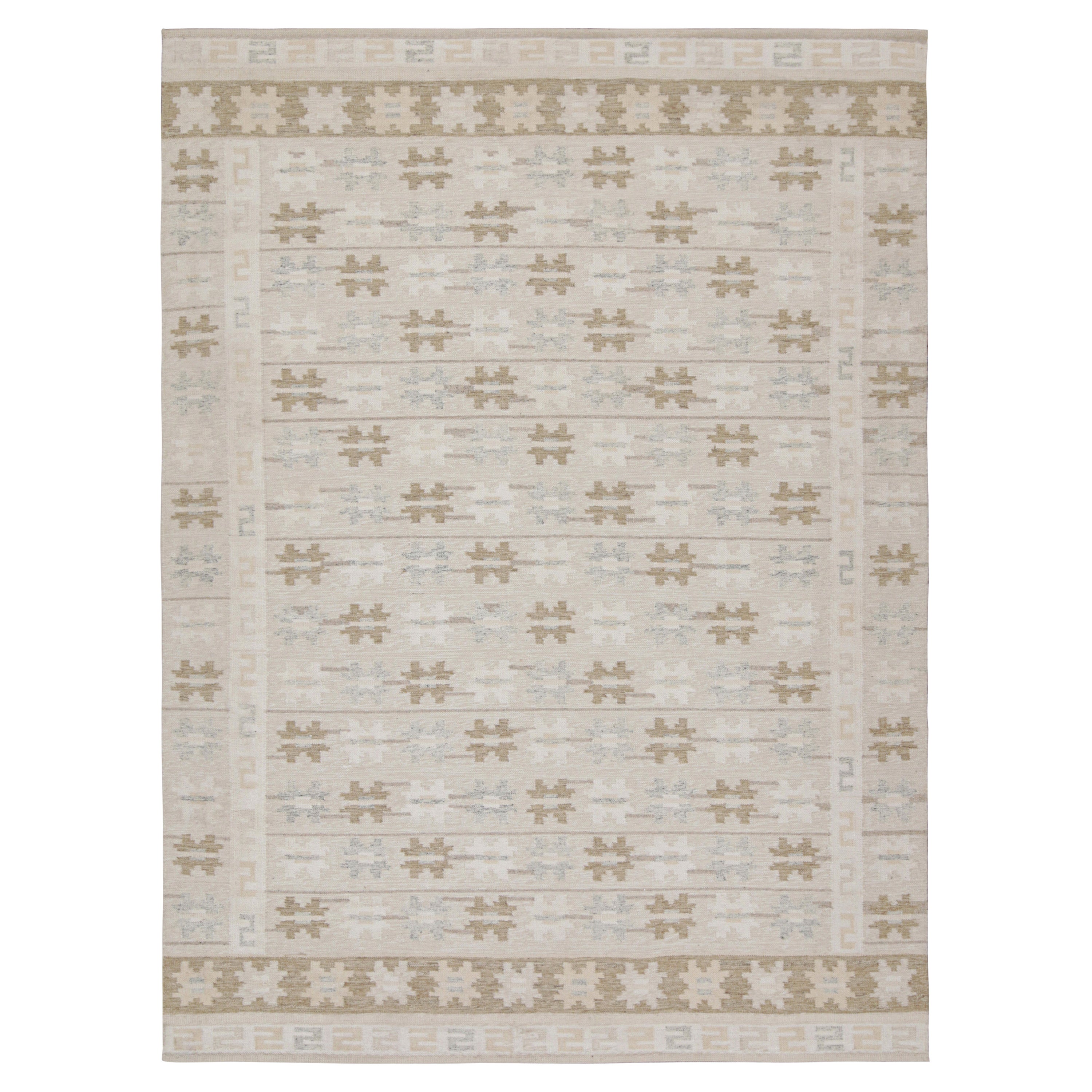 Rug & Kilim è un kilim in stile scandinavo con motivi geometrici color taupe e beige-marrone.