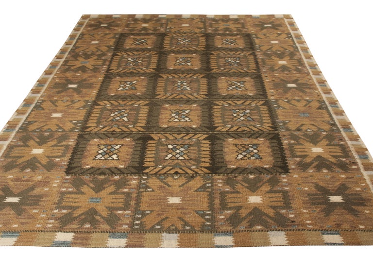 Handwoven in wool, a 10x13 flat weave from Rug & Kilim’s celebrated Scandinavian Kilim Collection. Celebrating Swedish Modernist aesthetics, the Kilim enjoys a gorgeous geometric pattern in luscious beige-brown hues deliciously punctuated by blue