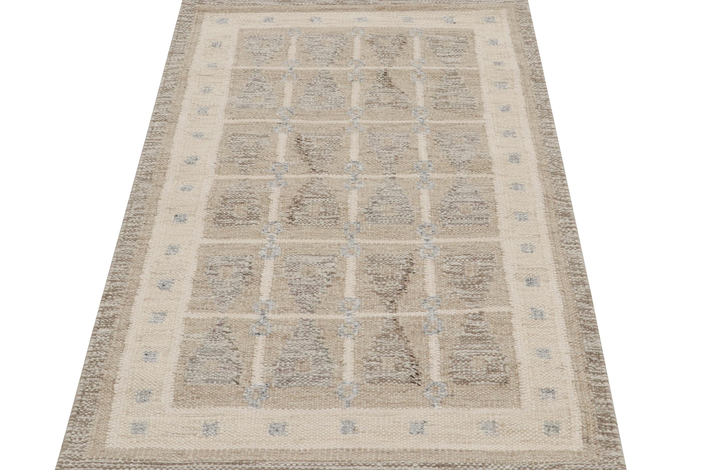A smart 3x5 Swedish style kilim from the “Nu” line of Rug & Kilim’s award-winning Scandinavian flat weave collection. Handwoven in wool. 
On the design: 
This rug enjoys a natural sense of movement with hourglass geometric patterns in beige-brown