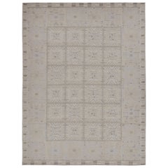 Rug 
Kilim è un tappeto Kilim in stile scandinavo con motivi geometrici bianchi e grigi.
