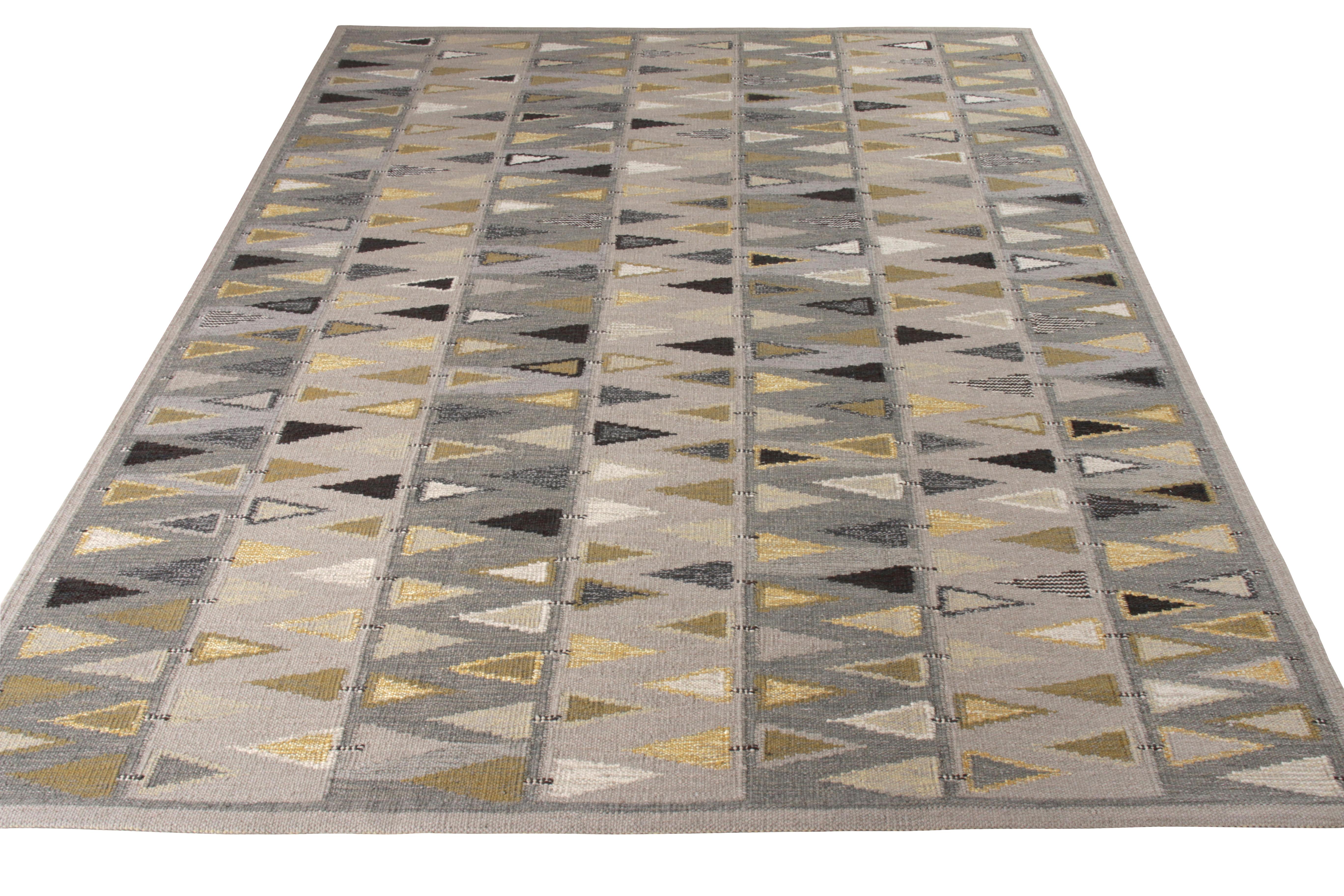 A 9 x 12 Kilim addition to Rug & Kilim’s celebrated Scandinavian Collection. This rendition of Swedish geometric style has an impeccable sense of character that runs across the weave in a matured colorway in gray with rich, playful accents. The play
