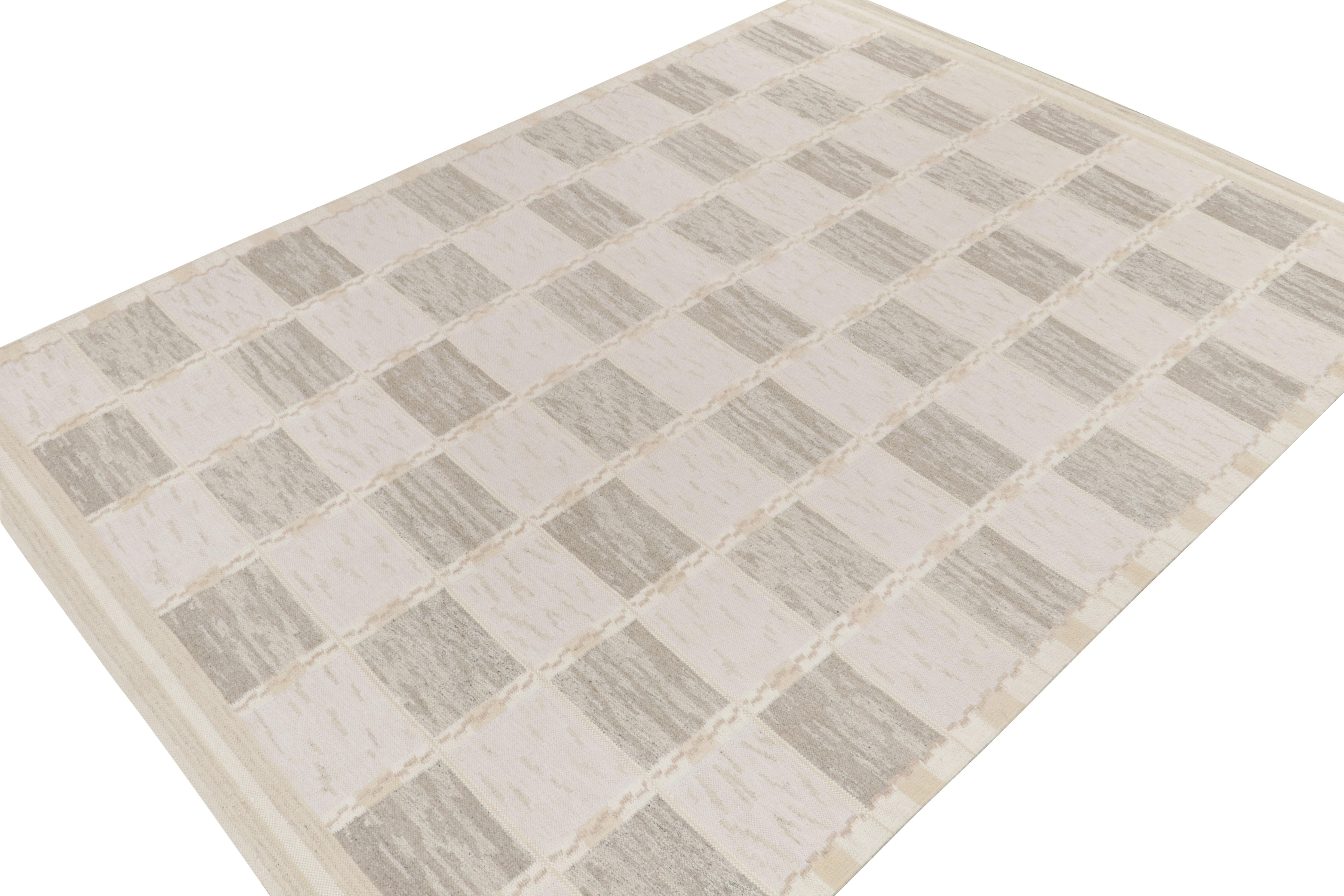 Exemplifying a modern take on Swedish Deco styles, a 10x14 flat weave from Rug & Kilim’s award-winning Scandinavian Kilim collection. The handwoven rug enjoys a smart application of geometry with well defined compartmentalisation entwining gray,