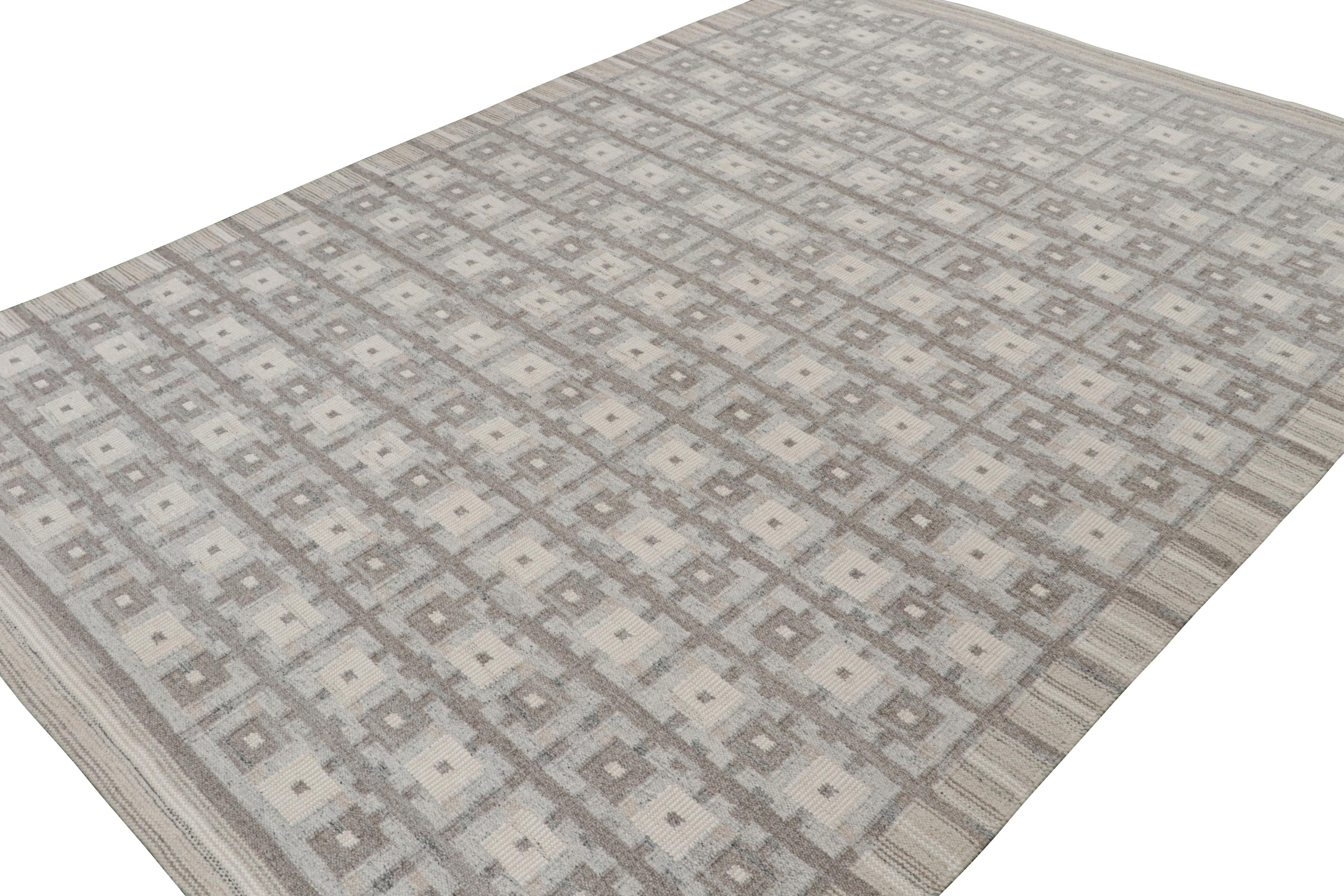 A smart 10x14 Swedish style kilim from our award-winning Scandinavian flat weave collection. Handwoven in wool & undyed natural yarns.

On the Design: 

This rug enjoys geometric patterns in gray and beige with cool light blue and white accents.