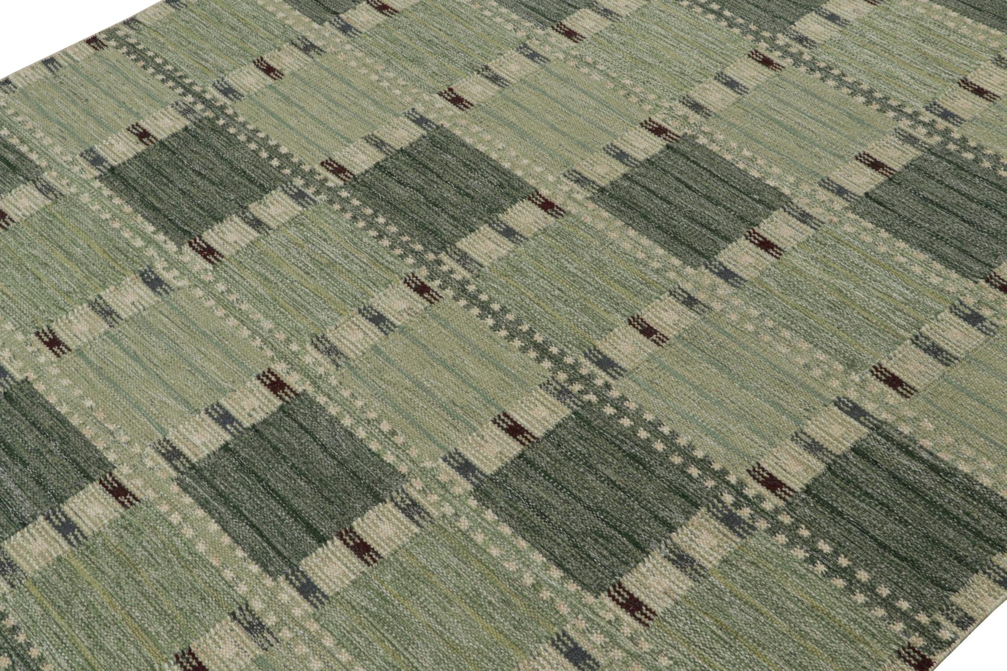 A smart 9x12 Swedish style kilim from our award-winning Scandinavian flat weave collection. Handwoven in wool. 

On the Design: 

This rug enjoys geometric patterns in enticing tones of green with subtle cream & brown accents. Keen eyes will