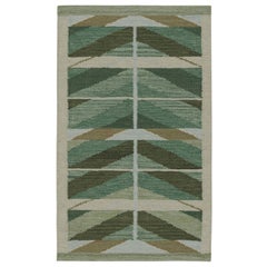 Kilim de style scandinave avec motifs géométriques dans les tons verts de Rug & Kilim