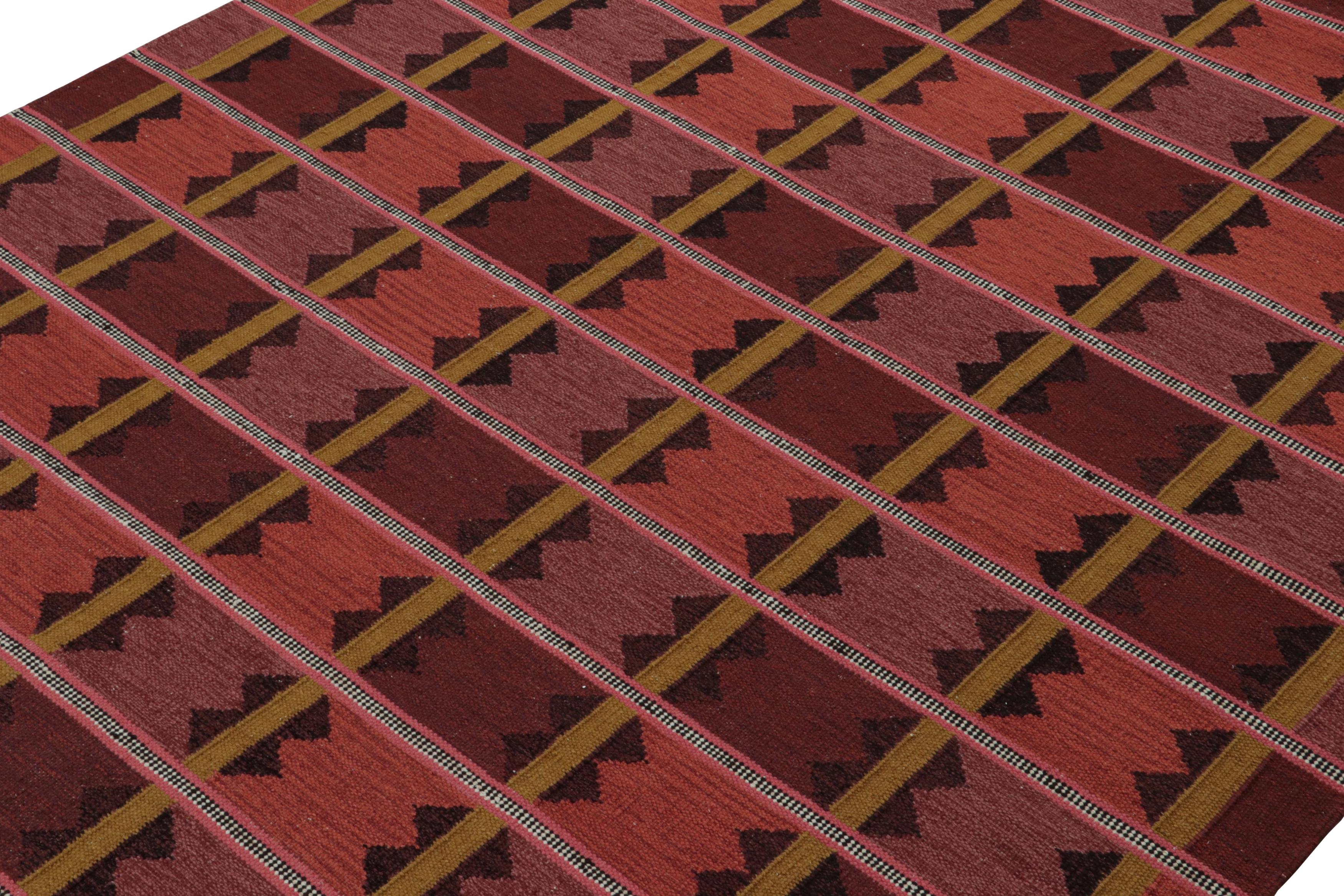 A smart 9x12 Swedish style kilim from our award-winning Scandinavian flat weave collection. Handwoven in wool. 

On the Design: 

This rug enjoys geometric patterns in enticing tones of red with gold. Keen eyes will admire undyed, natural yarns