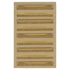 Rug & Kilim’s Scandinavian Style Rug in Beige, with Brown and Gold Stripes