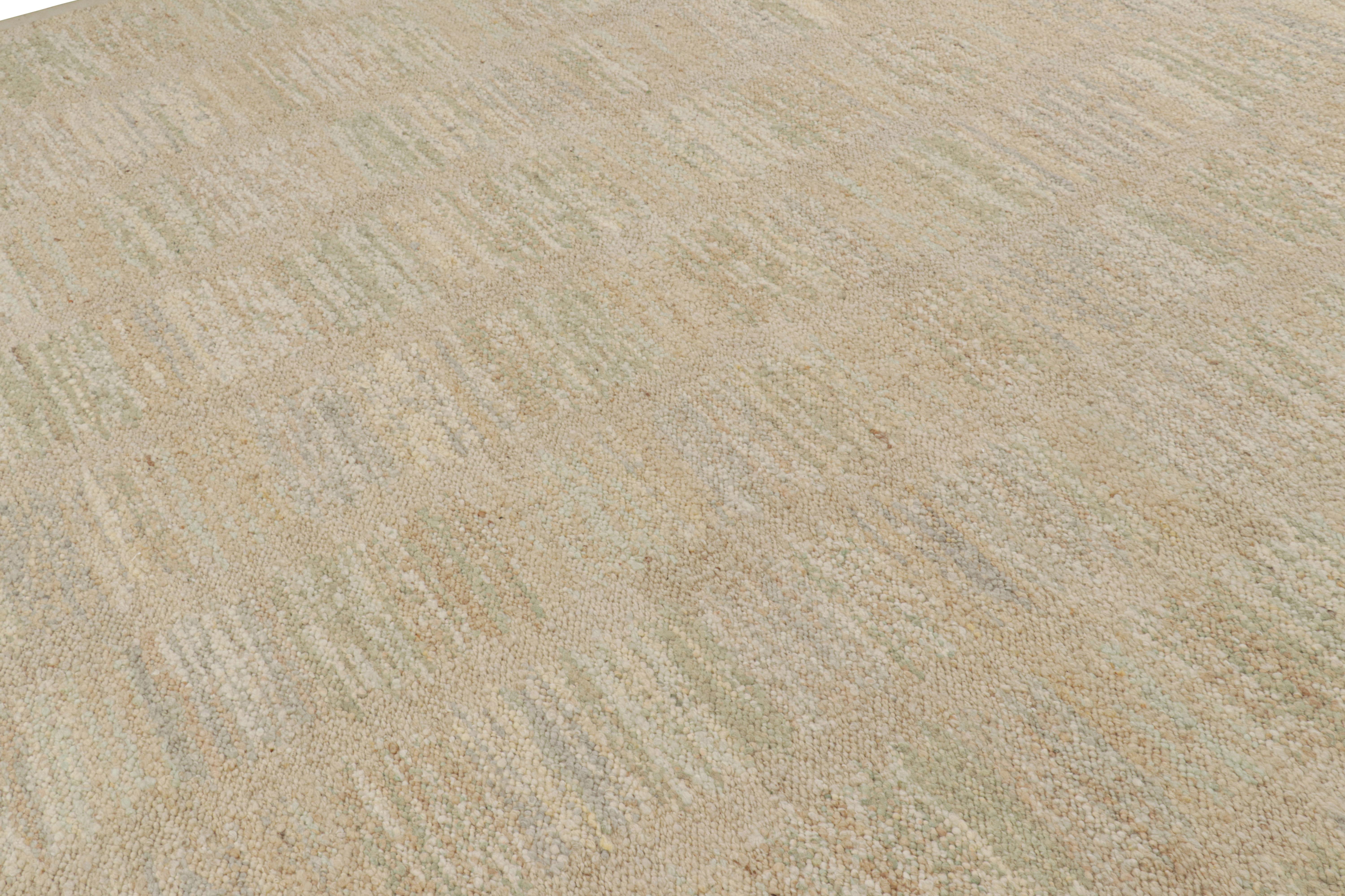 Ce tapis 10x14, tissé à la main en laine, est issu de la texture inventive 