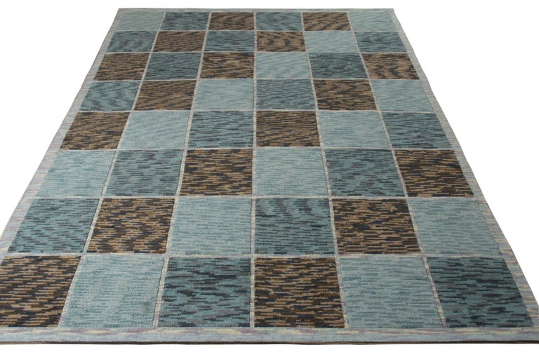 Hand knotted in wool, this modern 9x12 rug is the latest addition to Rug & Kilim’s celebrated Scandinavian Collection. The repeating geometric pattern sits comfortably in a marriage of blue and beige-brown hues with a high-low pile refinement. The