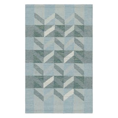 Tapis de style scandinave bleu et gris à motifs géométriques de Rug 
Kilim