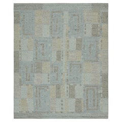 Rug & Kilim's Teppich im skandinavischen Stil in Blau, Beige und Grau mit geometrischen Mustern