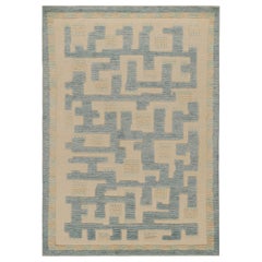 Rug & Kilim's Teppich im skandinavischen Stil in Blau und Beige mit geometrischen Mustern