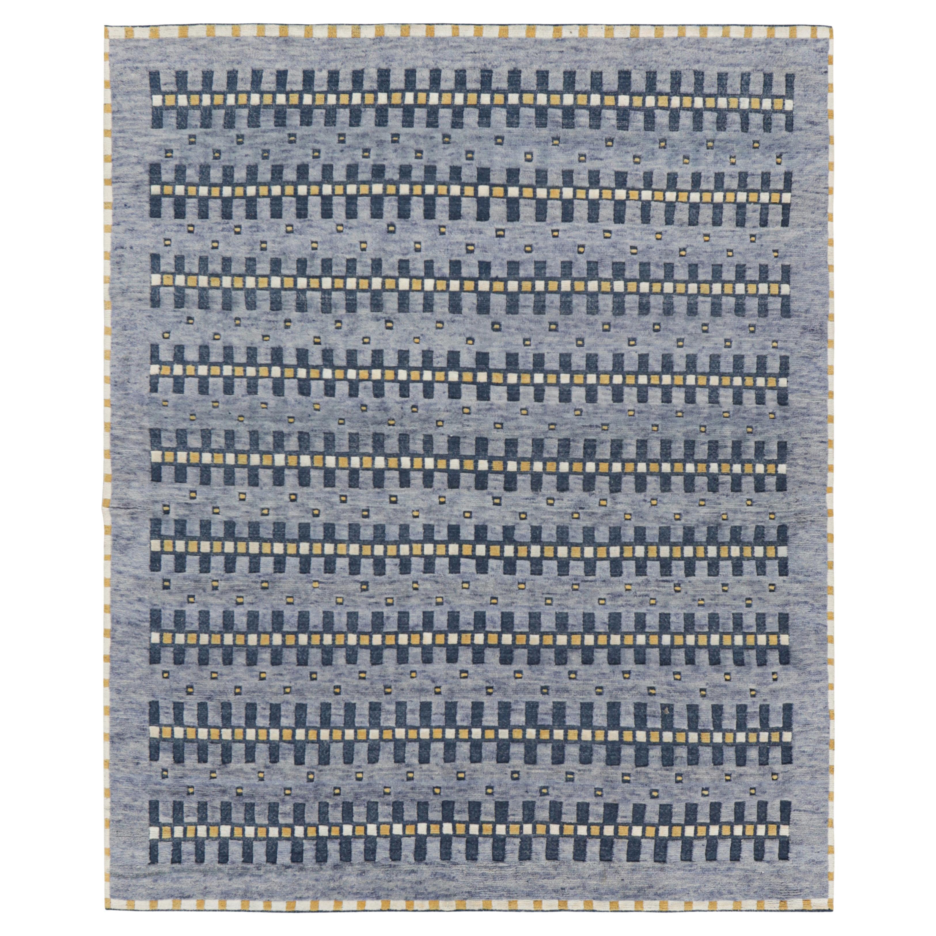 Rug 
Kilim: Tappeto in stile scandinavo con motivi geometrici blu, oro e bianco