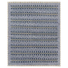 Rug 
Kilim: Tappeto in stile scandinavo con motivi geometrici blu, oro e bianco
