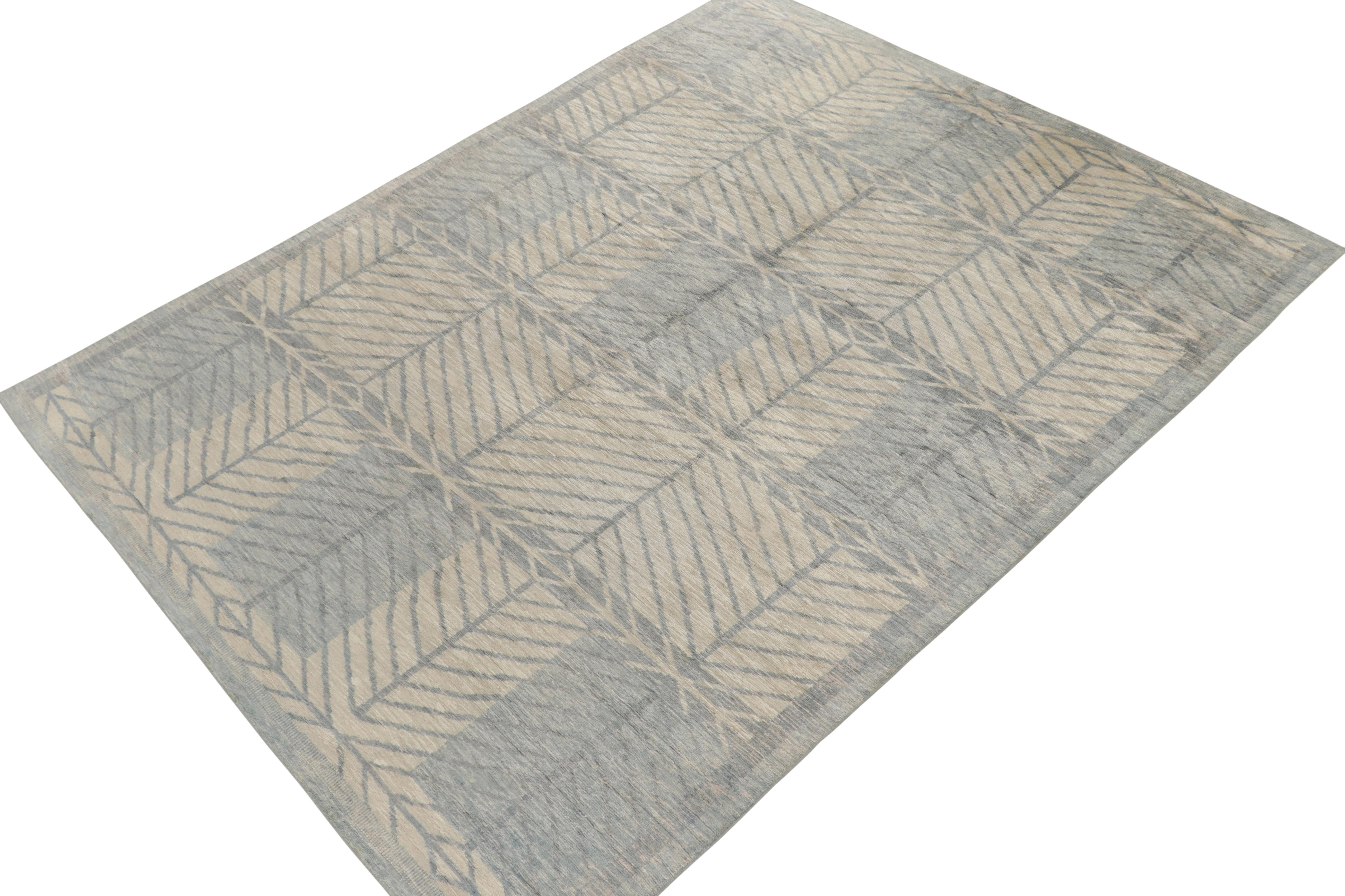 Hand-knotted in silk, from Rug & Kilim’s acclaimed Scandinavian rug collection reimagining the celebrated Mid-Century Modern style. 

This piece enjoys a defined Deco-style geometric pattern in cool blue, white and gray with tasteful striations