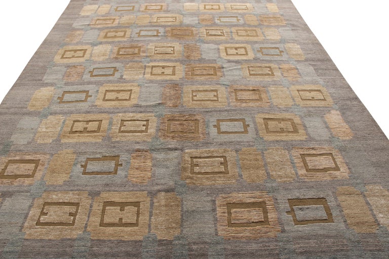 A 9x12 addition to the Scandinavian Collection by Rug & Kilim, recapturing acclaimed mid-century styles in new, dynamic form. Hand knotted in wool, exploring high-low texture married with the geometric pattern in smart gray, blue, and beige-brown