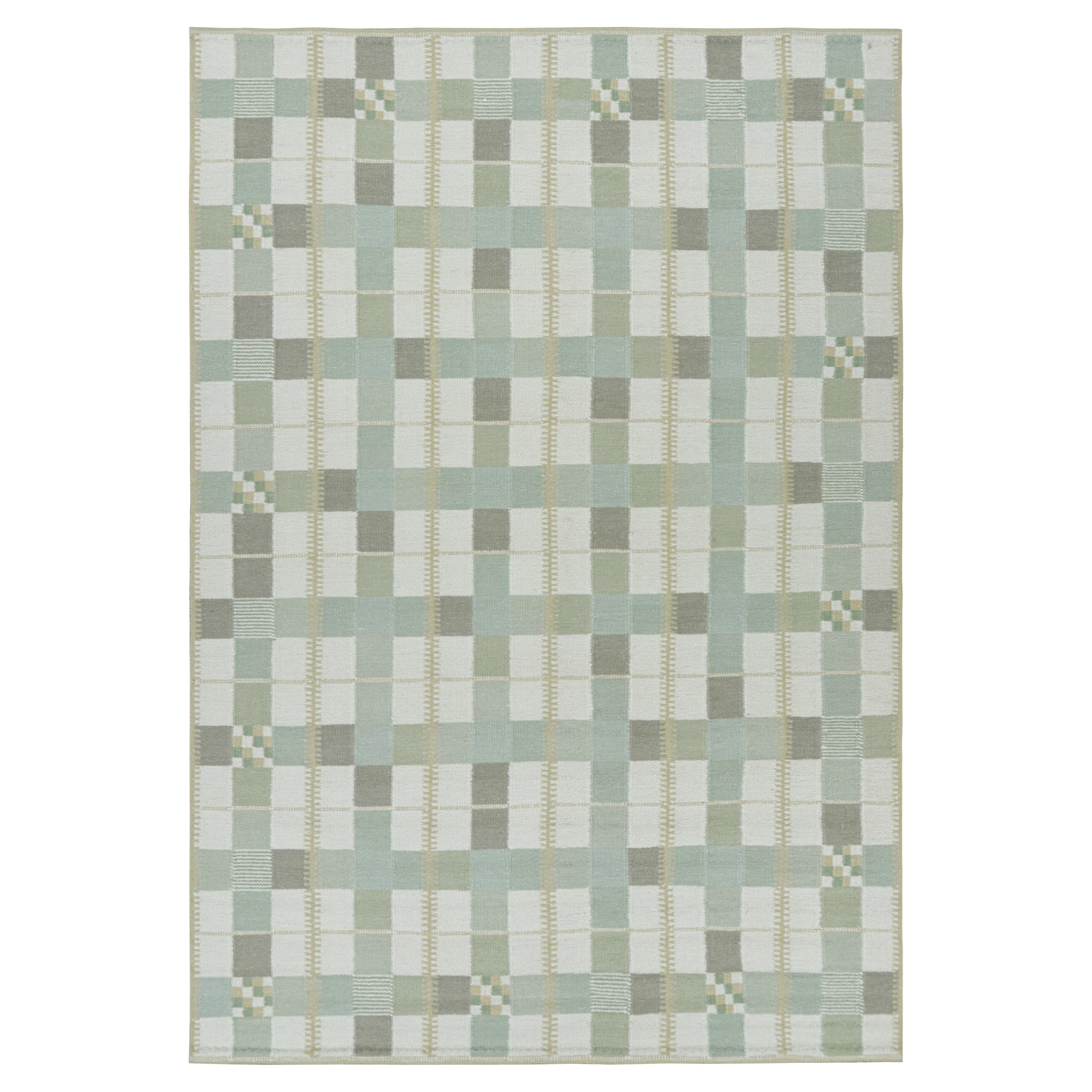 Tapis de style scandinave dans les tons bleus avec motifs géométriques de Rug & Kilim