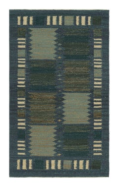 Tapis de style scandinave de Rug & Kilim dans les tons bleus, avec des rayures géométriques