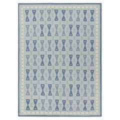 Rug & Kilim’s Scandinavian Style Rug in Blue Tones with Hourglass Patterns