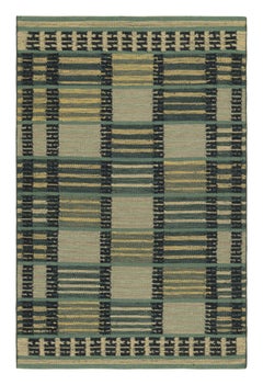 Tapis de style scandinave de Rug & Kilim dans les tons bleus, avec des rayures et des motifs