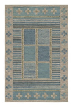 Rug & Kilim: tappeto in stile scandinavo di colore blu con motivi geometrici colorati