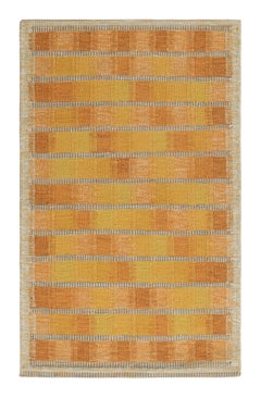 Tapis de style scandinave à motifs géométriques or et rose de Rug & Kilim