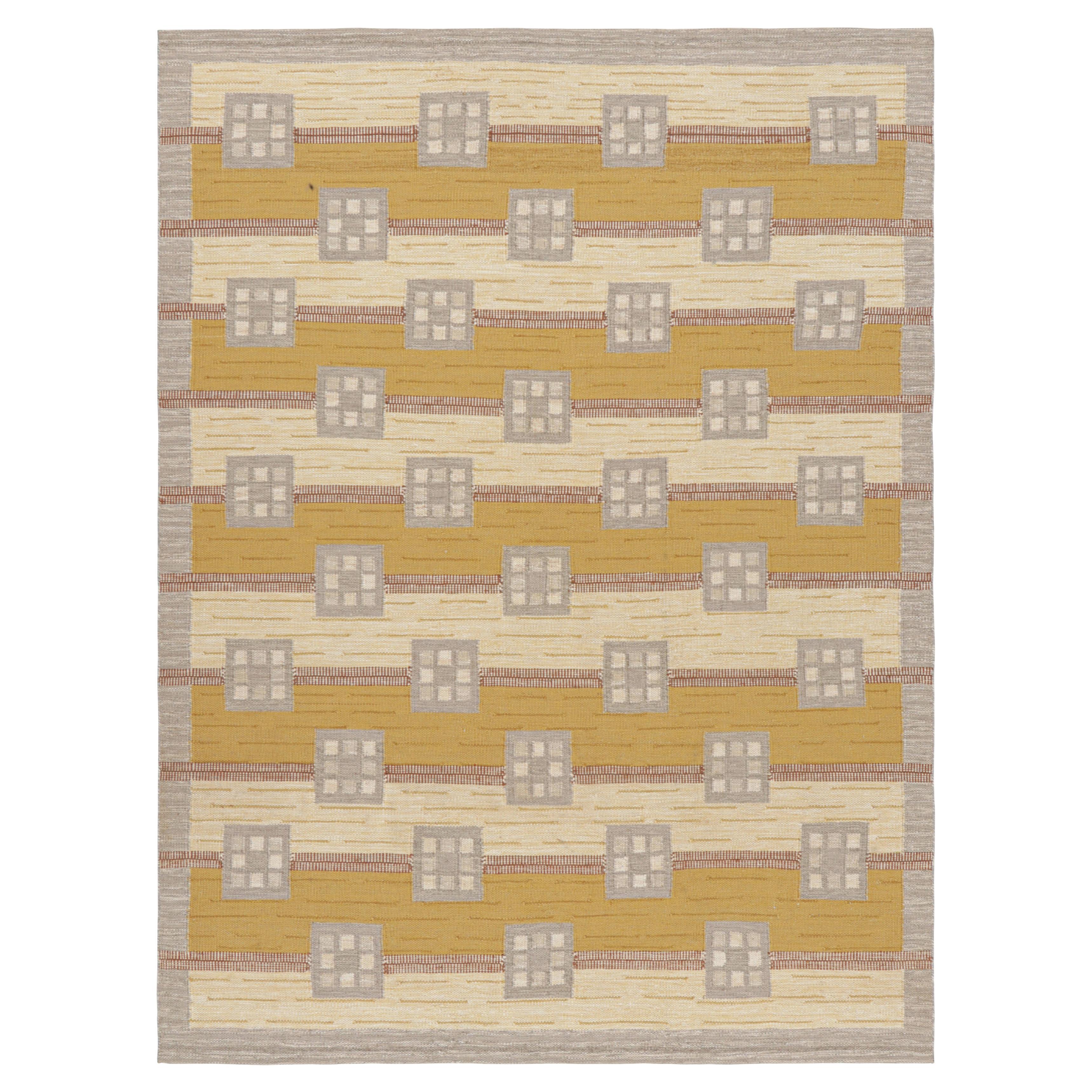 Tapis de style scandinave gris et or à motifs géométriques de Rug & Kilim