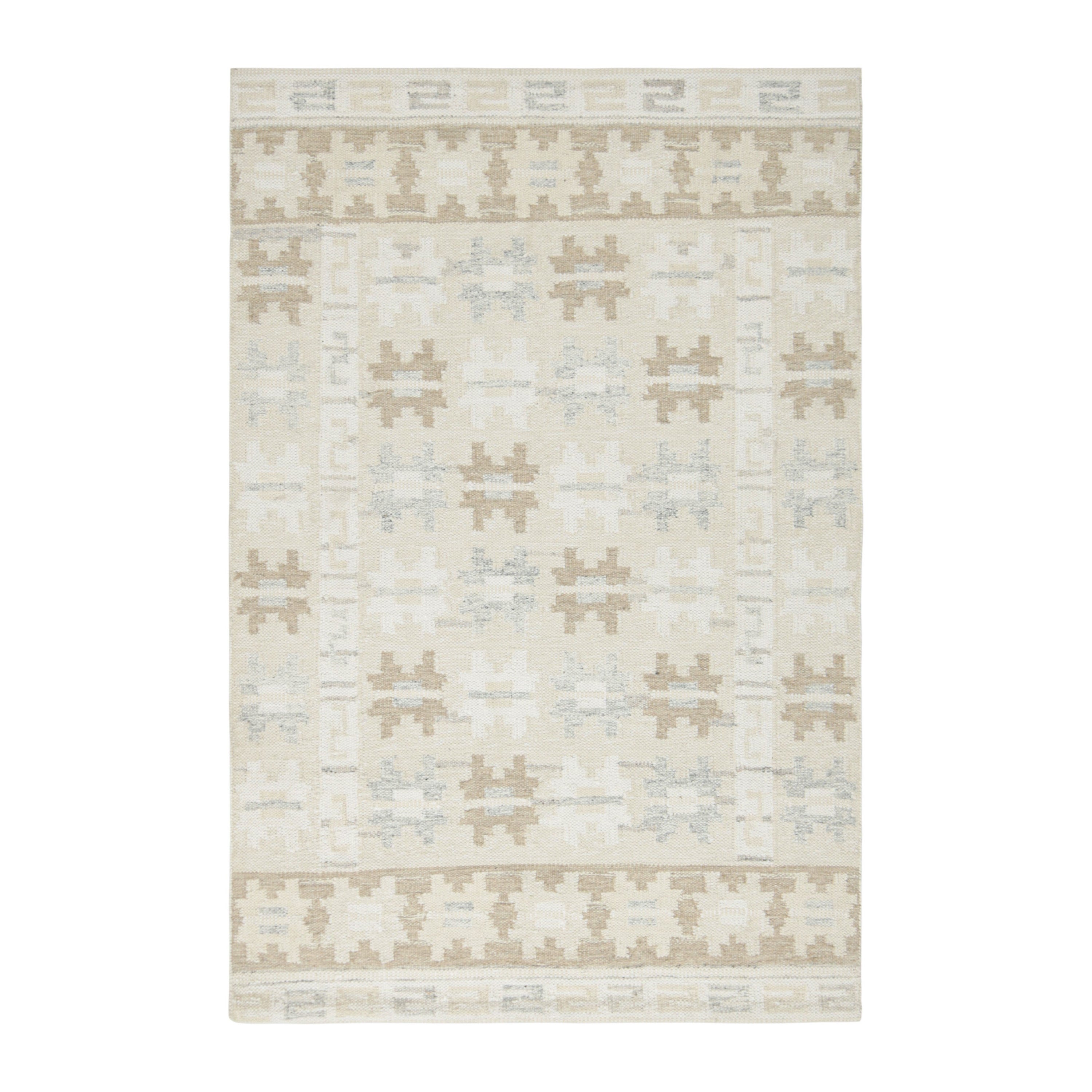 Rug & Kilim è un tappeto in stile scandinavo nei colori grigio e crema con motivi geometrici