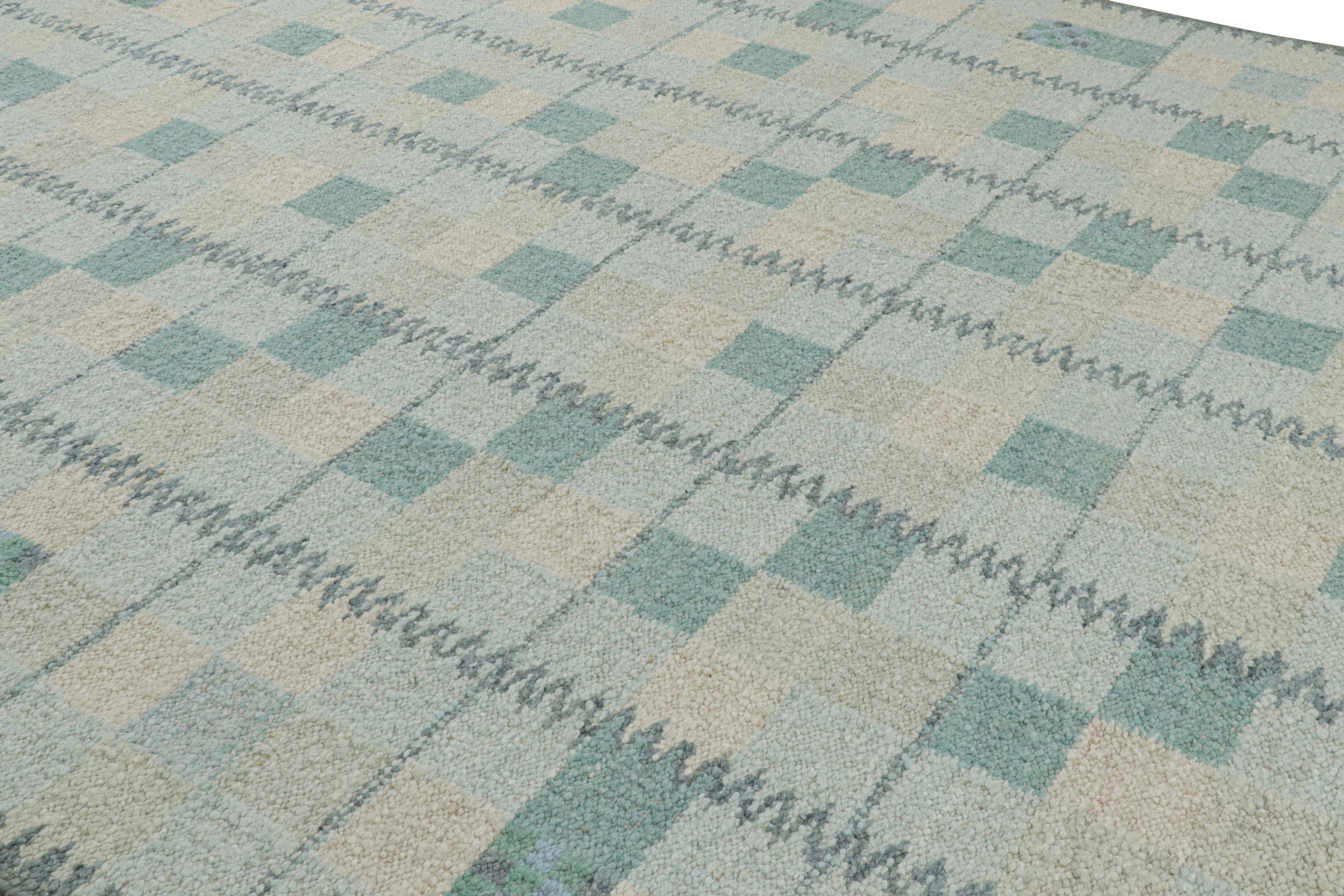 Ce tapis 10x14 de style suédois, tissé à la main en laine, est issu de la texture inventive 