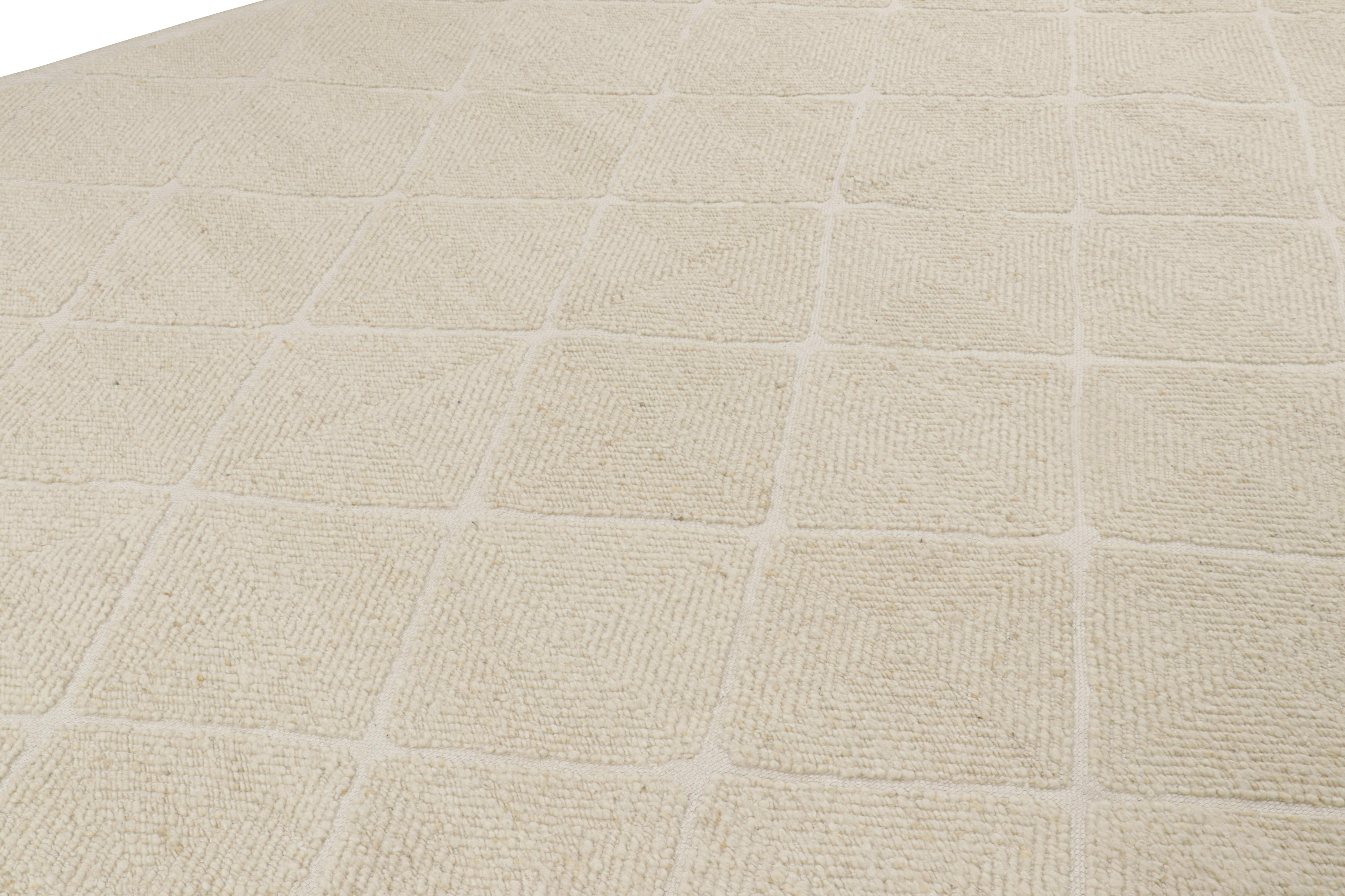 Ce tapis 10x14 d'inspiration suédoise, tissé à la main en laine, est issu de la texture inventive 