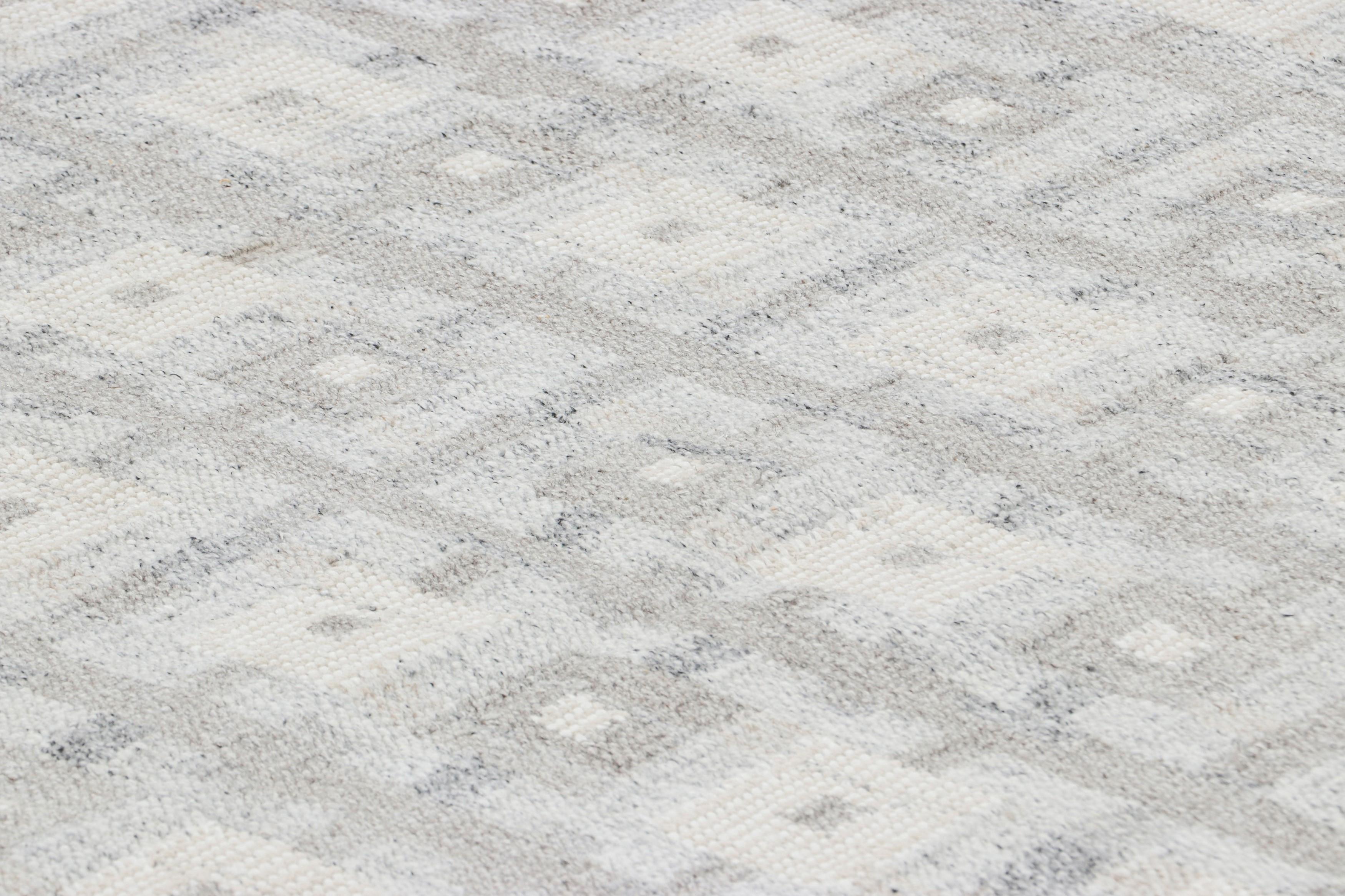 Made with handwoven wool, this 10x14 rug is an exciting new addition to Rug 
Kilim’s Scandinavian rug collection—a contemporary reimagining of Swedish minimalism and vintage rugs and textiles of Rollakan and Rya traditions.

On the Design: