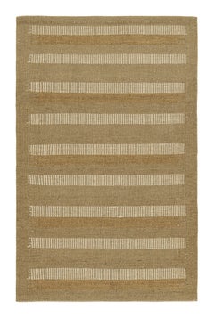 Rug & Kilim è un tappeto in stile scandinavo con strisce geometriche beige e taupe